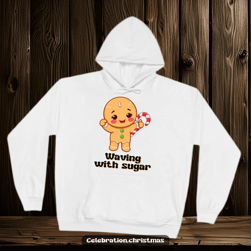 Funny Hoodie featuring a happy gingerbread cookie character waving a bright candy cane, ideal for cozy holiday wear.