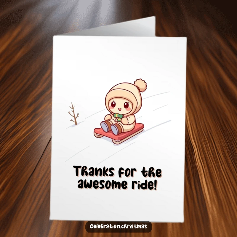 Funny Free Printable Thank You Card: Kawaii character happily sledding down a snowy hill, bringing winter cheer.